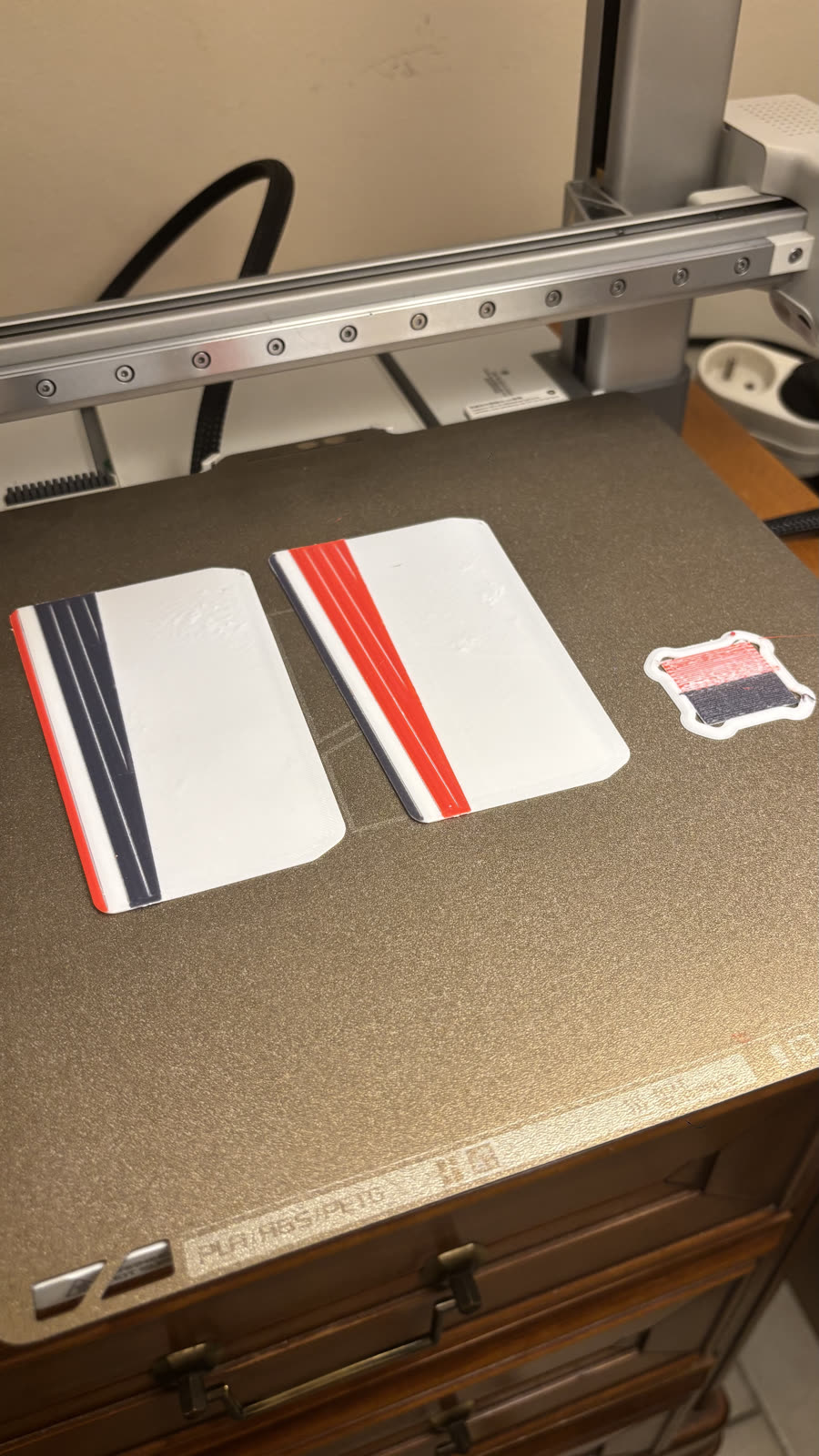 Step 1: printing the tongues flat, build plate heated to 70 °C (158 °F)